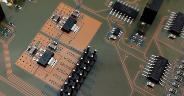 Linear voltage regulators with copper pours for heat dissipation.
