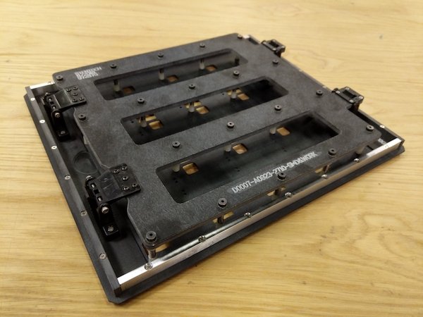 Wave pallet tooling to enable faster through hole connector soldering.